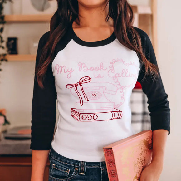 My Book is Calling Quarter Sleeve Baby Tee Shirt